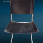 poltroncina vintage in acciaio cromato con seduta e schienale in cuoio nero anni '70