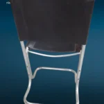 poltroncina vintage in acciaio cromato con seduta e schienale in cuoio nero anni '70