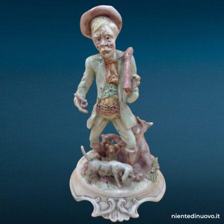 statua ceramica raffigurante cane con vecchio