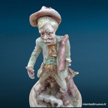 statua ceramica raffigurante cane con vecchio