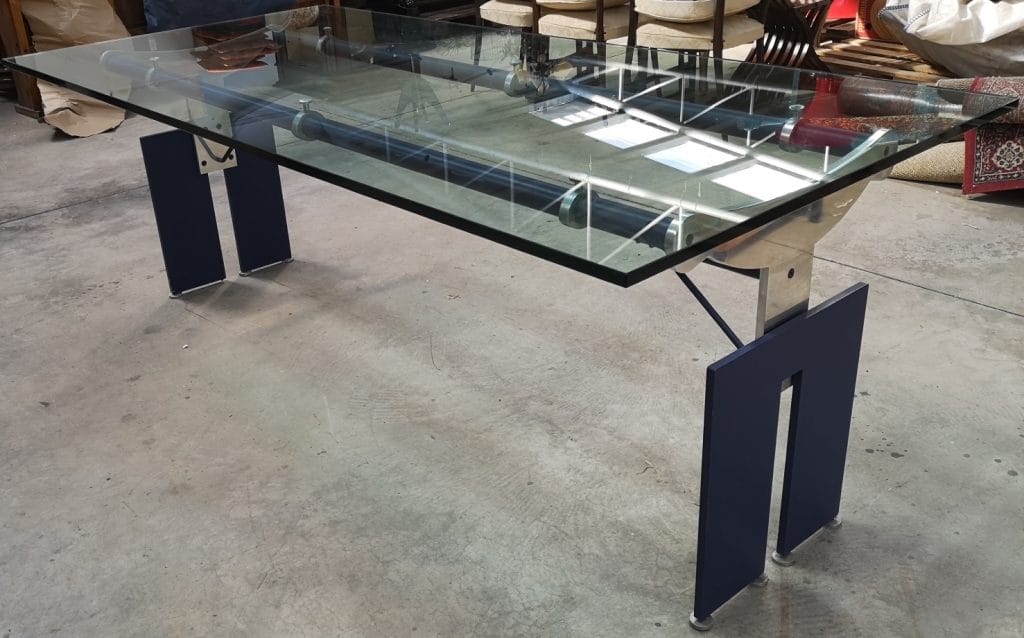 Tavolo design cristallo con struttura in acciaio e piano in vetro molato da 19 mm