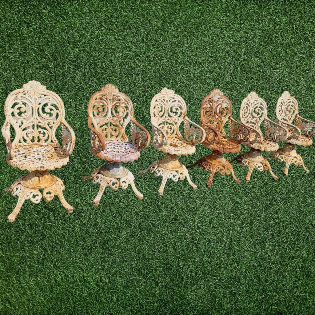 Poltrona Liberty da esterno in ghisa con dettagli eleganti e vecchie riparazioni.