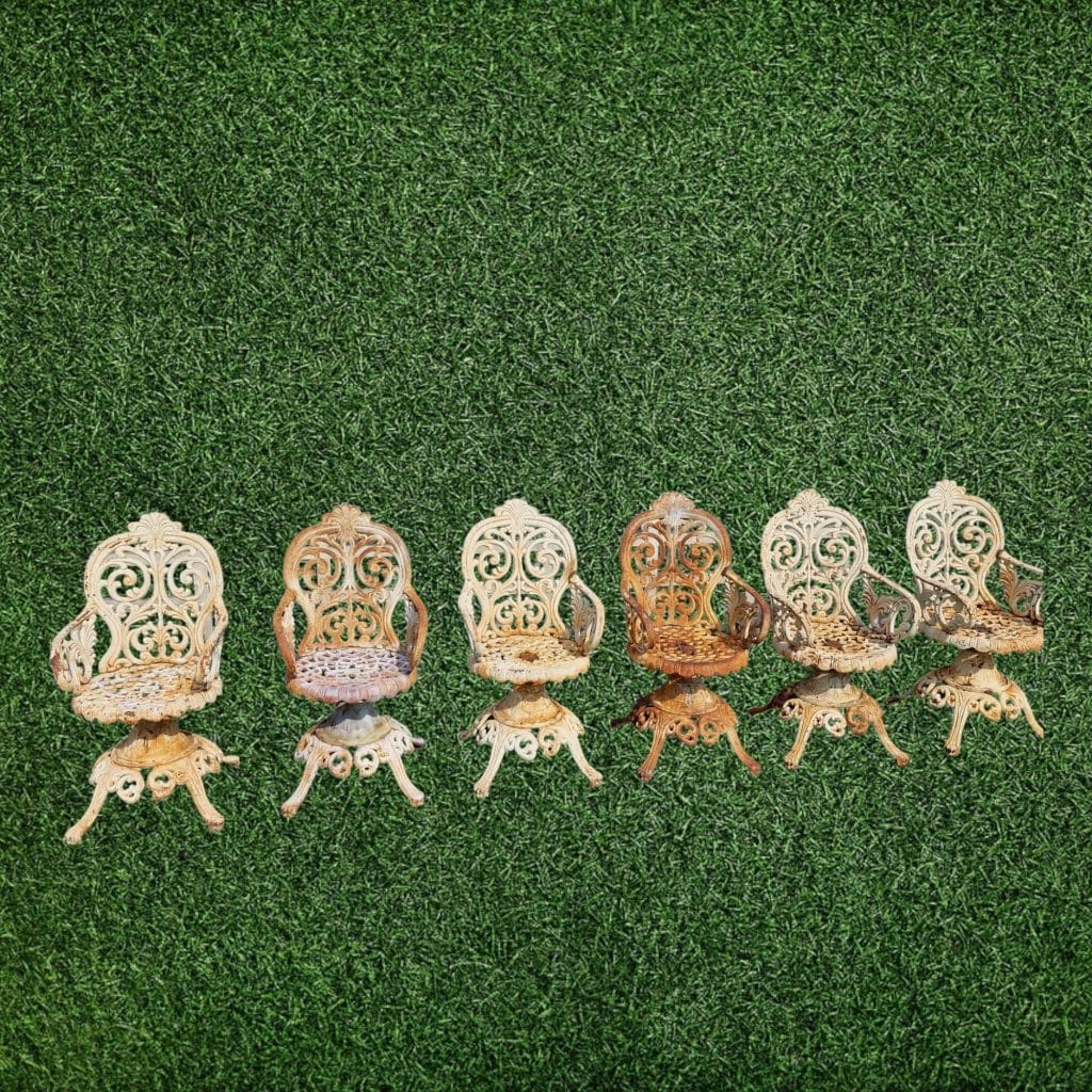 Poltrona Liberty da esterno in ghisa con dettagli eleganti e vecchie riparazioni.