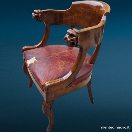 Poltroncina in noce 800 intagliata con seduta in cuoio