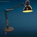 lampada a molle snodata con base in ghisa colore nero, stile vintage industriale