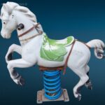 vecchio cavallino da giostra con base in metallo e mollone oscillante