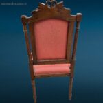 Sedia in legno primi '900 in stile Liberty con rivestimento rosato e intagli decorativi