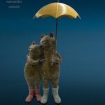 Coppia di rane in resina colorata con ombrello in ferro decorativo