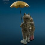 Coppia di rane in resina colorata con ombrello in ferro decorativo