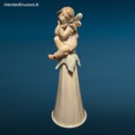 Porcellana LLADRÓ It’s a Girl con bambina seduta su fiore e campanellino