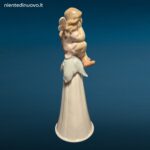 Porcellana LLADRÓ It’s a Girl con bambina seduta su fiore e campanellino