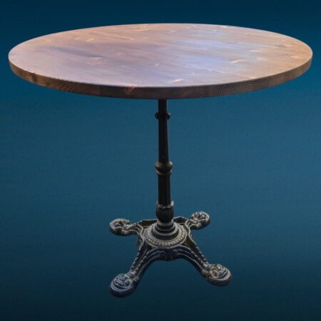 Tavolino da bar con base in ghisa lavorata e piano rotondo in legno massello tinto noce