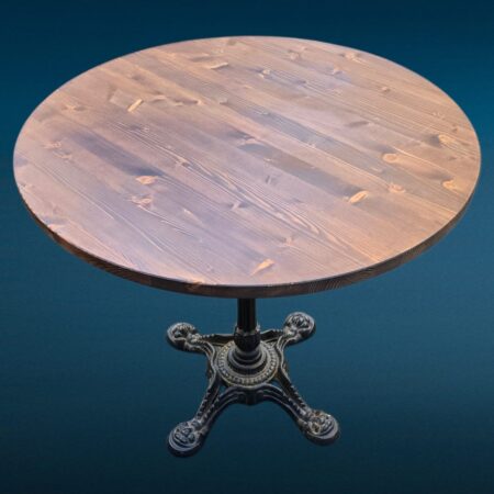 Tavolino da bar con base in ghisa lavorata e piano rotondo in legno massello tinto noce