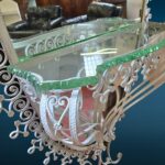 Specchiera ovale anni 50 Pierluigi Colli in ferro martellinato con mensola