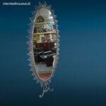 Specchiera ovale anni 50 Pierluigi Colli in ferro martellinato con mensola