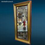 Specchio da parete incorniciato con lavorazione a bisello formato 27x56