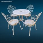 Salottino completo da esterno vintage in ferro battuto con quattro sedie e tavolino rotondo