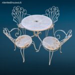 Salottino completo da esterno vintage in ferro battuto con quattro sedie e tavolino rotondo