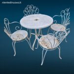 Salottino completo da esterno vintage in ferro battuto con quattro sedie e tavolino rotondo